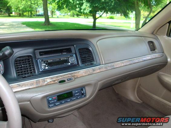 Interior dashboard with Pioneer stereo and wood trim