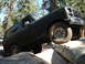 1984 Ford Bronco - This Ford Bronco navigates a rocky obstacle course in a wooded area.