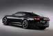 1994 Ford Probe - A black coupe is shown from a rear 3/4 angle against a neutral background.