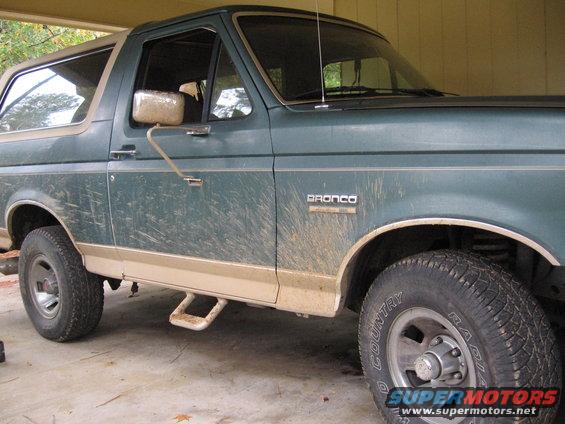 Green 1989 Ford Bronco, 3/4 front view, showing side and tan trim