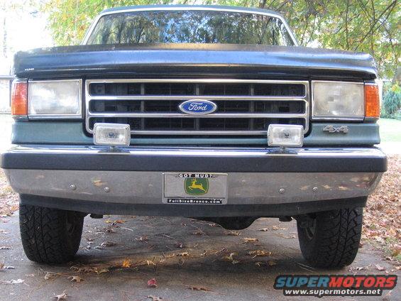 Green Ford Bronco front view, chrome bumper, "Got Mud?" license plate, "4x4" badge