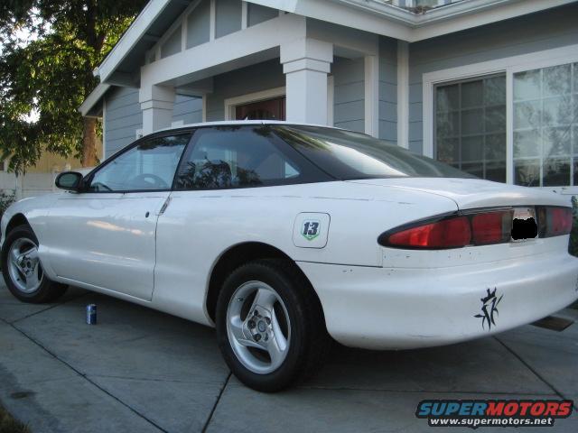 White 1995 Ford Probe coupe parked on a driveway, rear-right quarter view