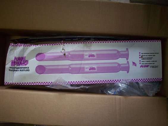 Box containing two Flowtech Purple Hornies high-performance glasspack mufflers