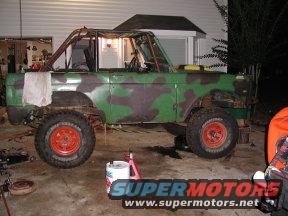 passenger_side_rear_lift.jpg View of the pasenger side after the rear lift.  It is hard to tell but the rig has 35" tires and the tops of the fenders are 55" hight