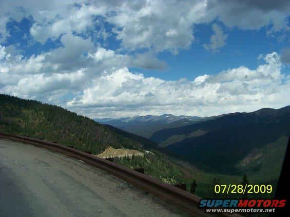 Mountain landscape with road and guardrail, dated 07/28/2009