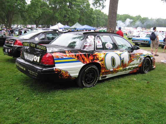 Police car with flames and '01' decals, seen from the 3/4 front