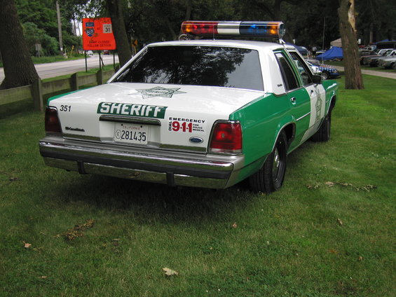1991 Ford Crown Victoria sheriff car, rear view, white and green