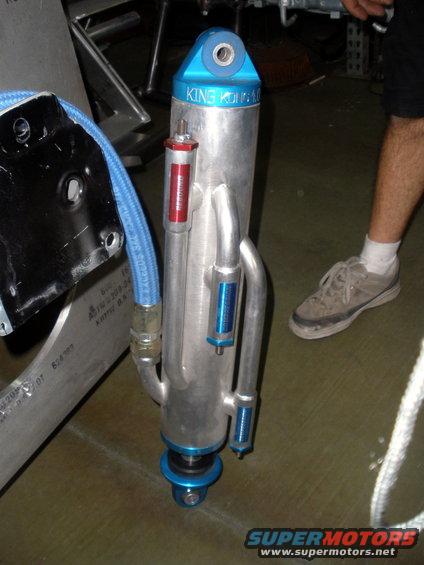 King Off-Road Racing shock absorber with blue top and reservoir. Part number visible on a red label