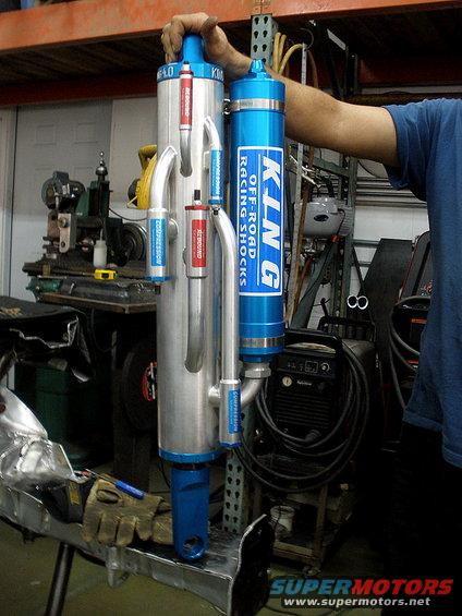 King Off-Road Racing Shocks with blue reservoirs and silver bodies