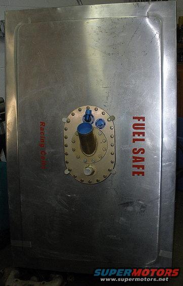 Fuel safe with "Racing Cell" and "FUEL SAFE" text, and a central fitting with blue and brass caps