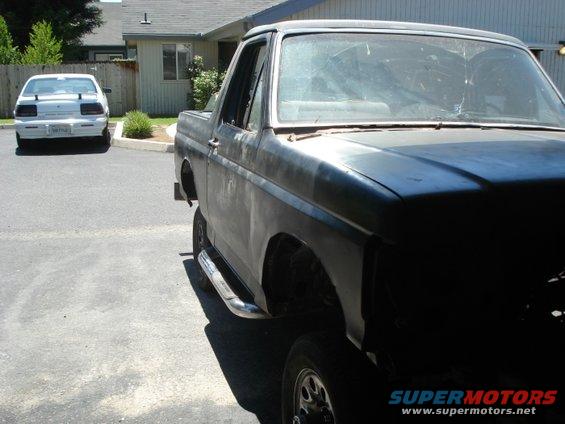 Black Ford Bronco, unfinished body, side view with chrome step bars