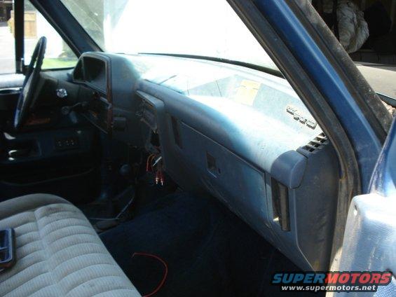 Interior dashboard of a 1990 Ford Bronco, showing the passenger side