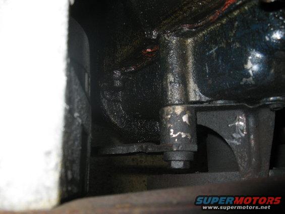 img_0920.jpg The Ford FE low mount Alternator adjustment bracket attaches to this boss on the timing cover. Earlier FE's from high mount applications may not have this boss on the cover.