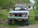 1984 Chevrolet Blazer - This light blue pickup truck is missing its grille and headlights, sitting in a grassy yard.