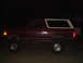 1992 Ford Bronco - This 1992 Ford Bronco is shown from the side, a two-tone red and white color scheme.