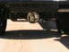 1985 Ford Bronco - Underside view of a vehicle's rear differential and suspension system.