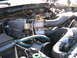 1985 Ford Bronco - Close-up view of an engine bay, highlighting the intake manifold and various hoses.