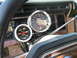 1985 Ford Bronco - Interior view of a 1985 Ford Bronco shows aftermarket gauges on the steering column.