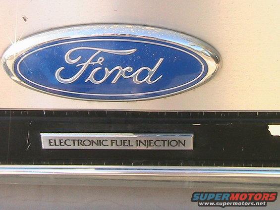 Ford emblem above 'Electronic Fuel Injection' badge on a vehicle