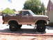 1985 Ford Bronco - This lifted Ford Bronco is shown from the side, with a spare tire mounted on the rear.