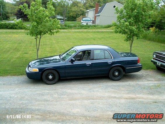 Dark blue 1998 Ford Crown Victoria sedan, side view