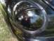1999 Volkswagen Beetle - Close-up of the distinctive headlight on a 1999 Volkswagen Beetle.
