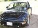1999 Volkswagen Beetle - This black 1999 Volkswagen Beetle is shown from a front 3/4 angle.