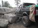 1991 Ford Bronco - This Ford Bronco appears to be from the early 1990s, not a 1991 model, as it navigates a rocky off-road course.