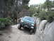 1991 Ford Bronco - Ford Bronco navigating a challenging rocky trail, with another vehicle following.