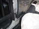 1991 Ford Bronco - Close-up of a 1991 Ford Bronco's side, showing the door jamb and fender detail.
