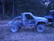 1985 Toyota Pickup/SR5 - Modified 1985 Toyota Pickup/SR5 with roll cage and removed doors, parked outdoors.