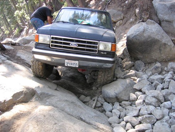 1989 Ford Bronco navigating a rocky trail, front view. License plate 3PVA855