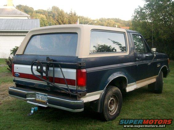1987 Ford Bronco rear view with spare tire carrier and license plate EYI-6069