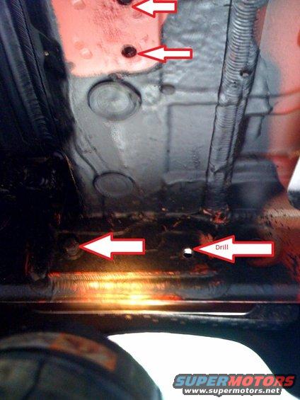 Underbody with drill points indicated by red arrows and text