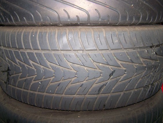 stack of used tires, close-up on tread pattern