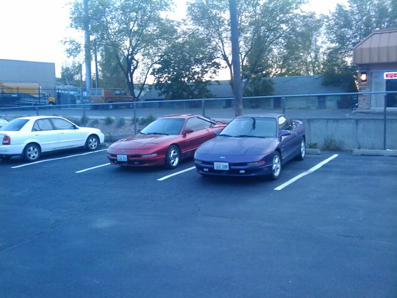 Purple 1994 Ford Probe parked in a lot, front 3/4 view