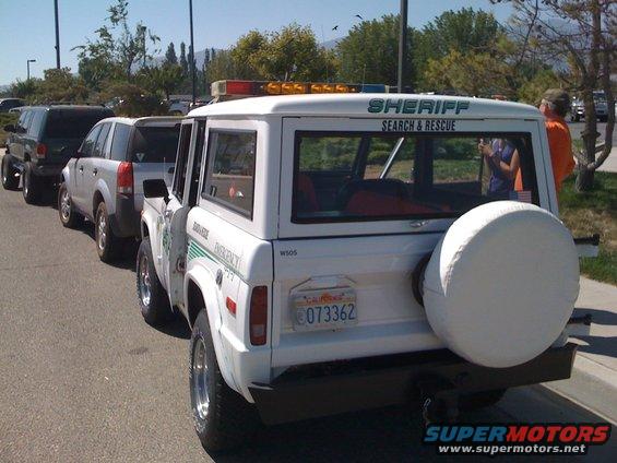 White 1995 Ford Bronco Sheriff Search & Rescue SUV with spare tire on rear