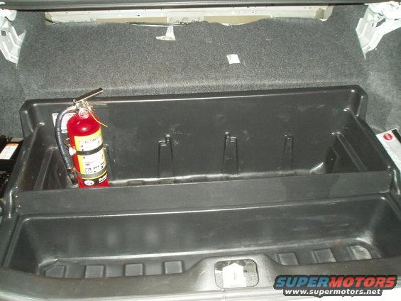 Car interior with red and white object on dashboard