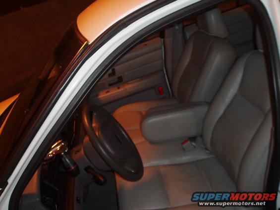 2003 Ford Crown Victoria interior showing driver's seat, steering wheel, and dashboard
