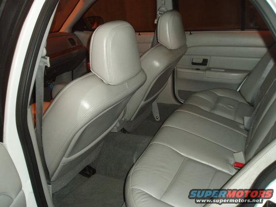Car interior with light-colored seats and door panels