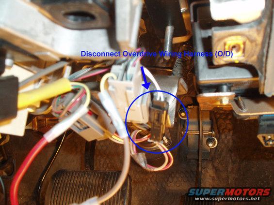 The column shifter is now free, you will no longer need that or any of the other parts you removed, including the old column interlock and brackets. The last part is to disconnect the overdrive harness.