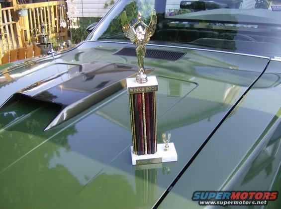 Green 1970 Ford Ranchero hood with a trophy and a scoop