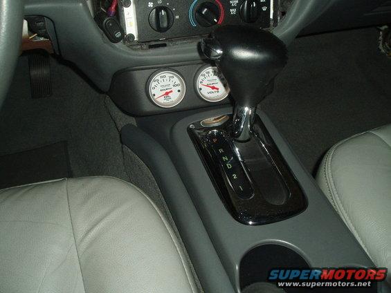 Interior with oil and voltage gauges and automatic gear shifter