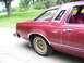1979 Ford Thunderbird - Rear side view of a maroon 1979 Ford Thunderbird with gold turbine wheels.
