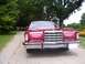 1979 Ford Thunderbird - A red 1977 Ford Thunderbird is parked on a gravel driveway with trees and a gate in the background.