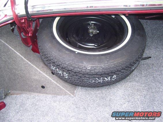Spare tire in trunk with white lettering