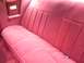 1979 Ford Thunderbird - Interior shot of a red velour rear seat with white piping.