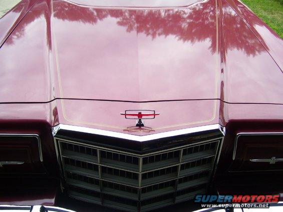 Red 1979 Ford Thunderbird front grille and hood ornament