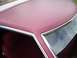 1979 Ford Thunderbird - Close-up of the maroon vinyl roof and interior of a 1979 Ford Thunderbird.