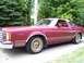 1979 Ford Thunderbird - This maroon coupe with gold wheels is a 1977 Ford Thunderbird, identified by its distinctive body style.